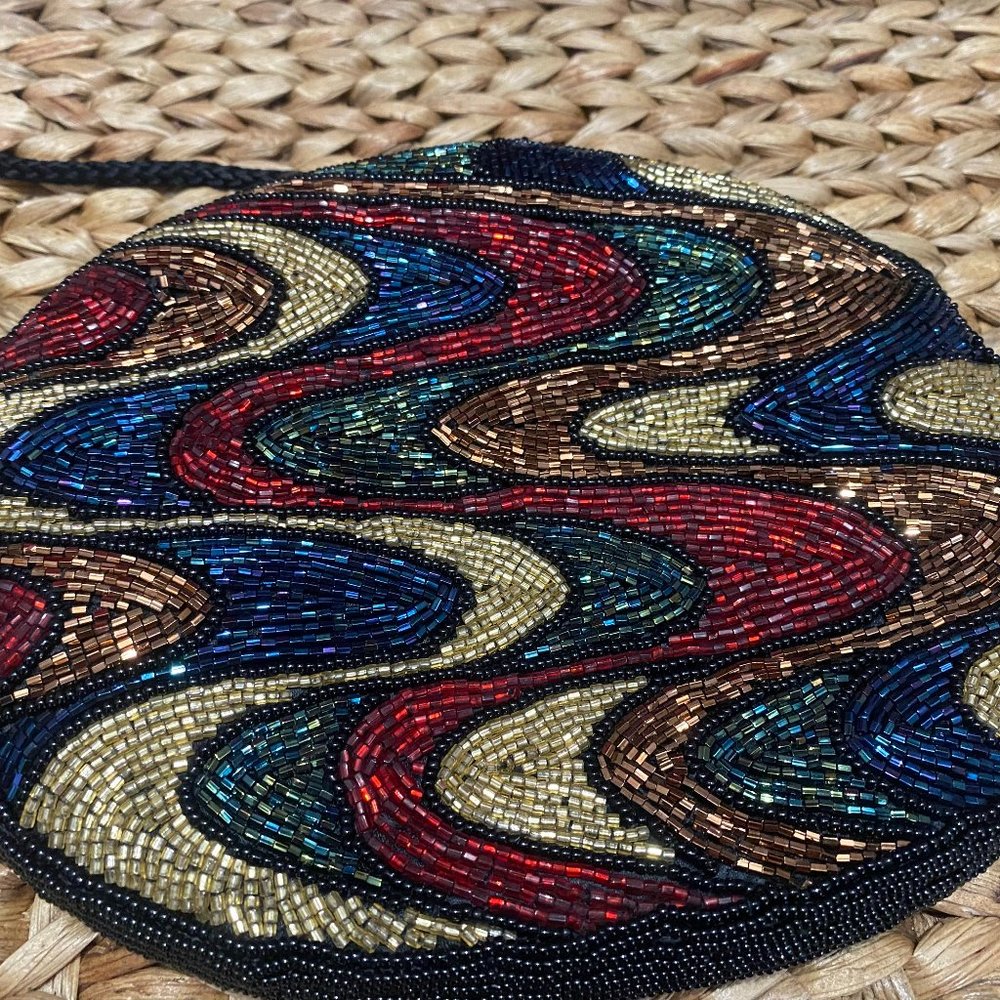 Beaded bag with strap.